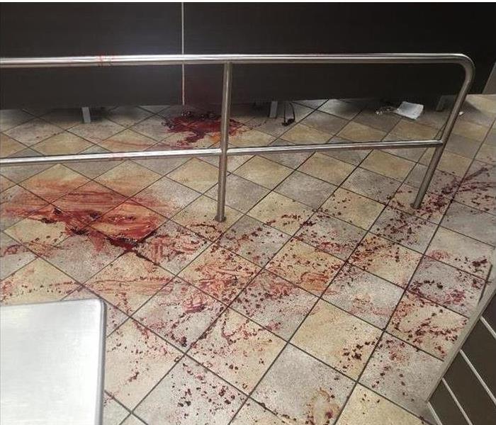 Restaurant floor covered in blood. 